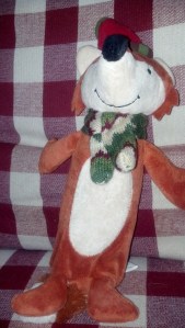 Yoda's latest terror: the crinkly toy!! Come to think of it, Yoda might be afraid of all stuffed animals. He hasn't really played with or picked up any since he was a puppy. It's just rawhide and Nylabones for him!